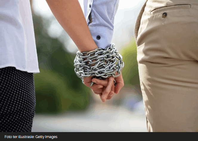 Couple holding hands
